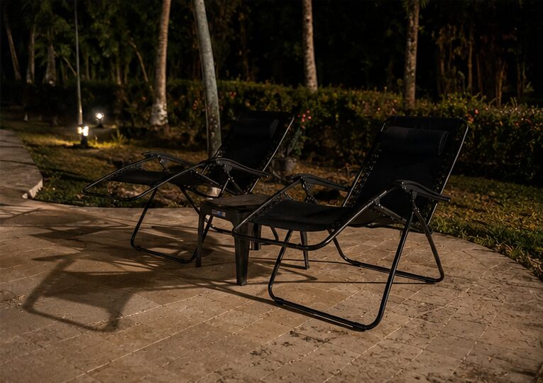 Reclining loungers on the terrace, beside the lawns